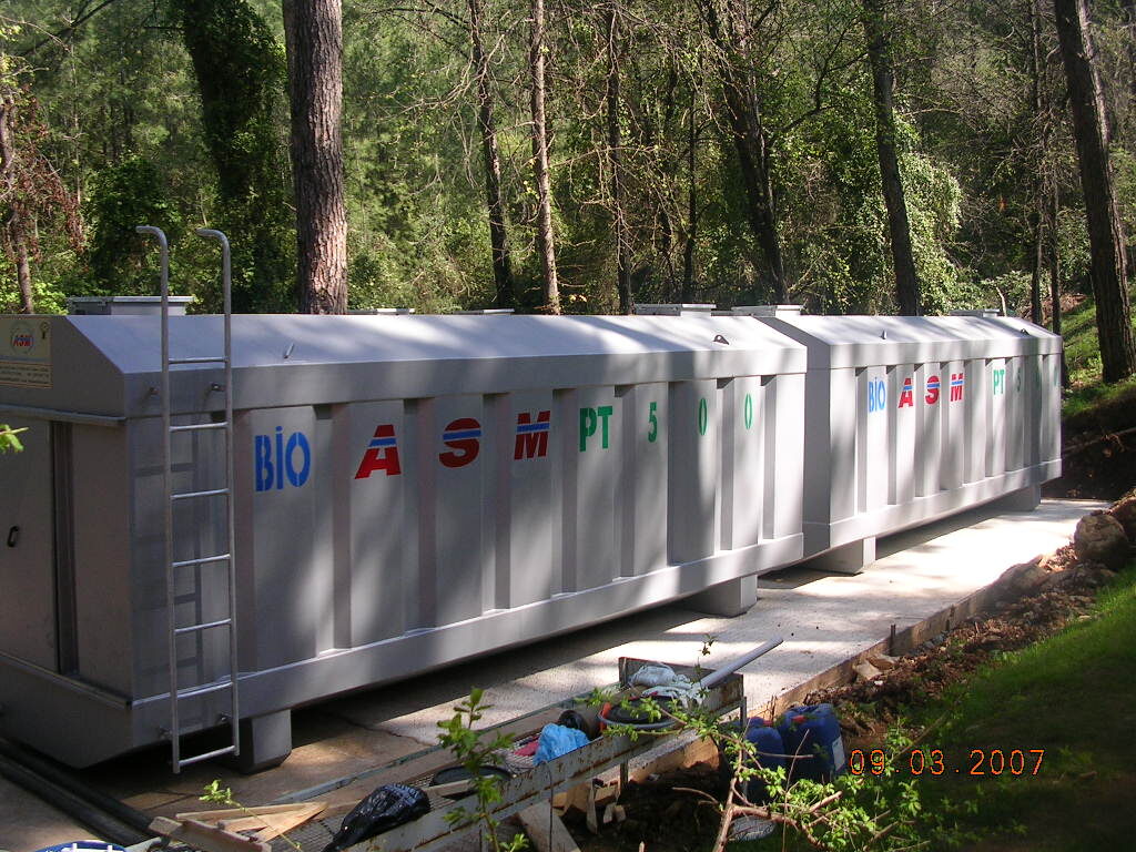 BIOASM PT-500 packaged treatment plant installed at a forested site